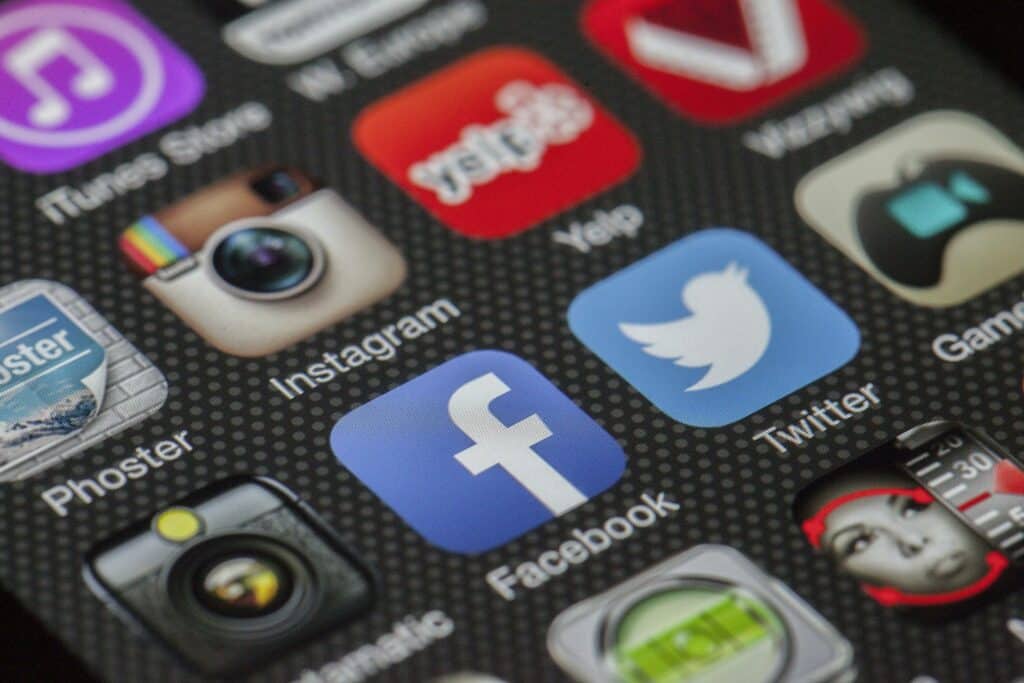 Social media apps on a phone screen.